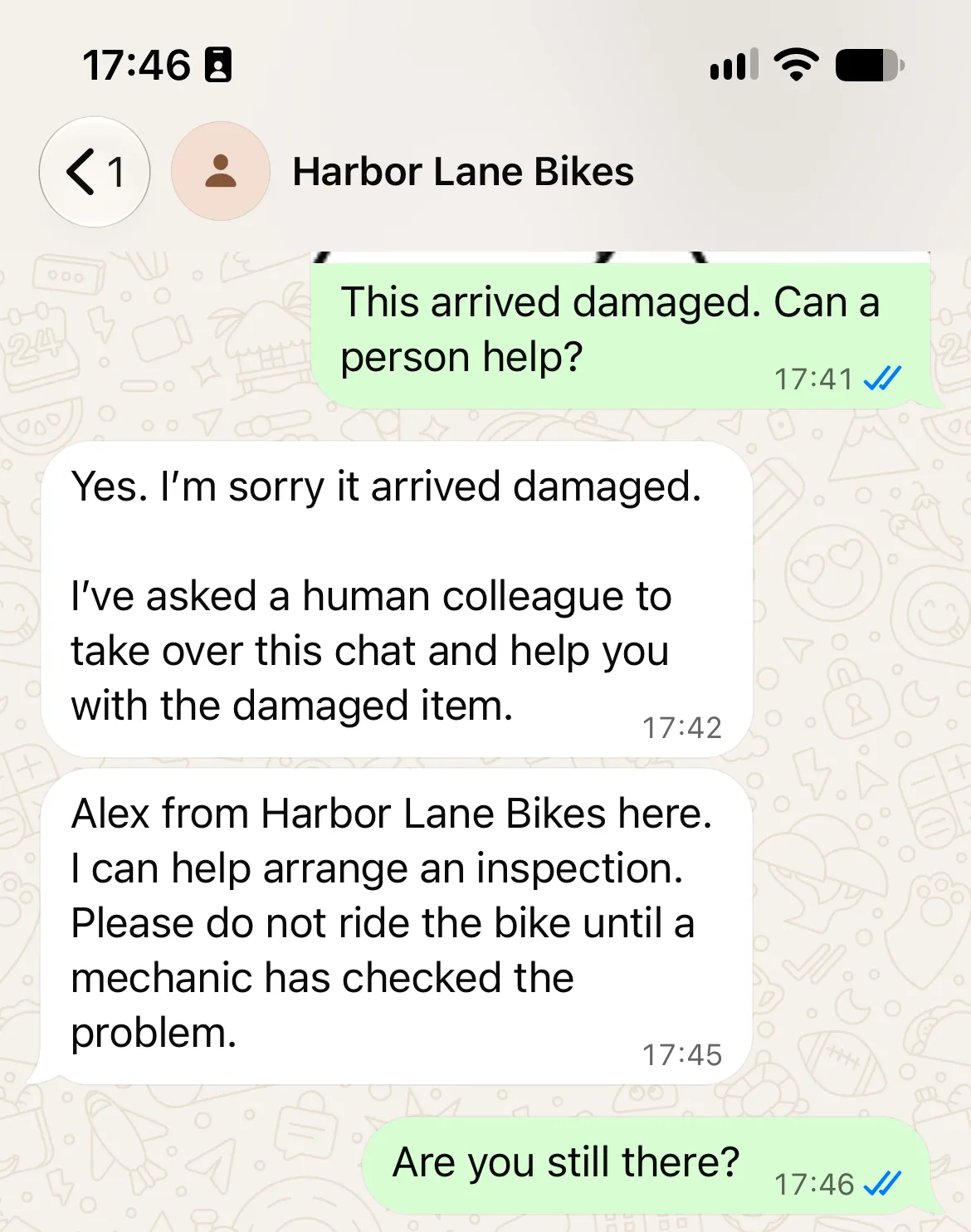 WhatsApp conversation showing Alex from Harbor Lane Bikes replying to the damage case and offering to arrange an inspection