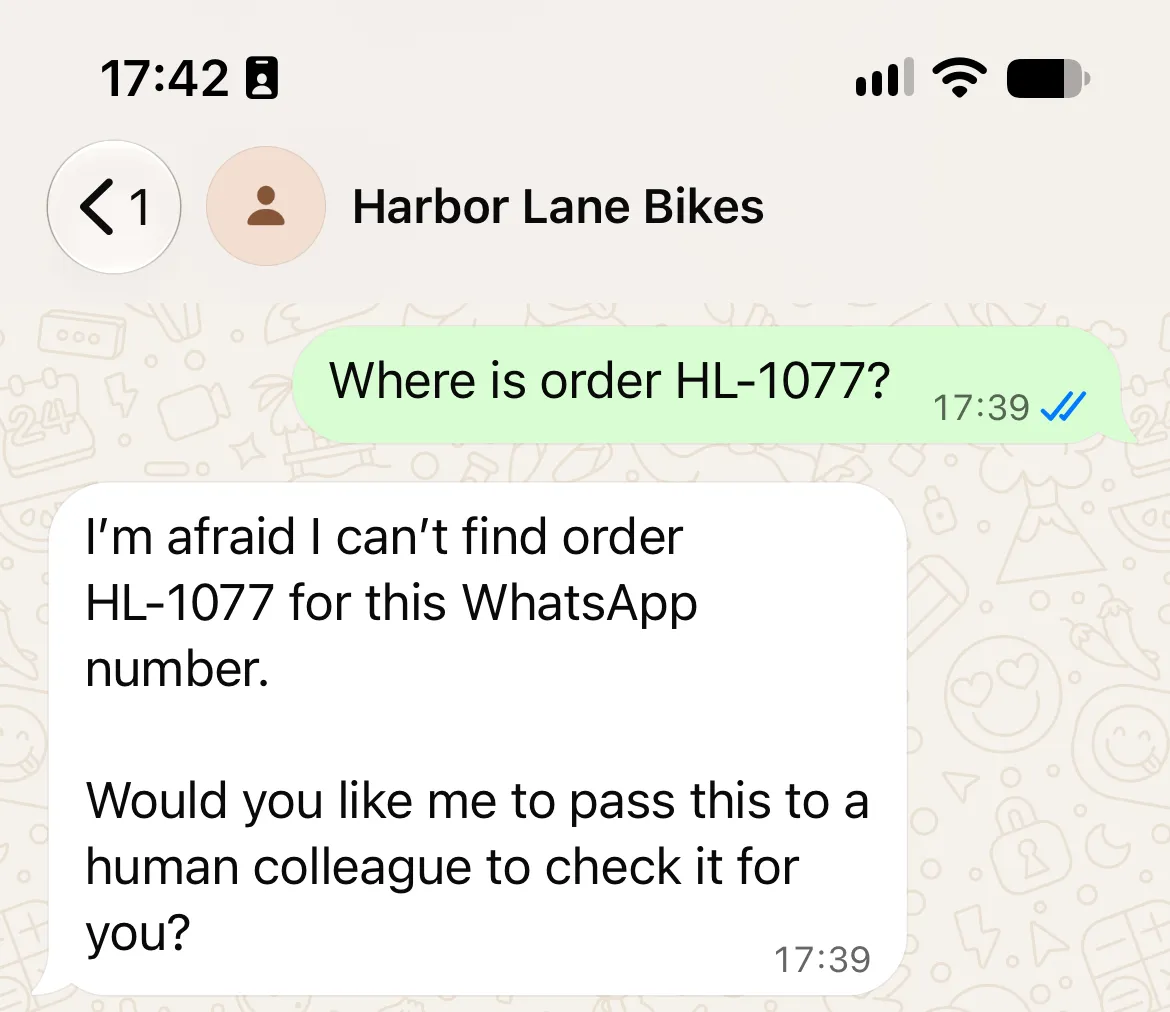 WhatsApp reply declining to reveal order HL-1077 because it could not be found for the sender's number